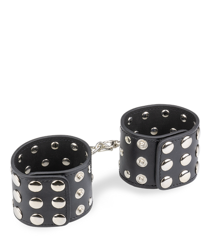 Menottes poignets cuir noir rivets